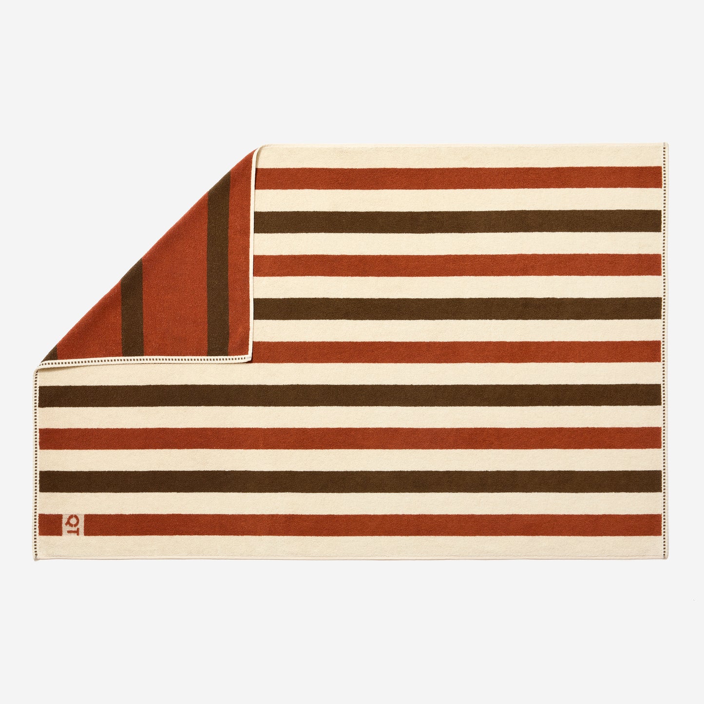 Full view of catalina bath sheet in chocolate featuring double sided stripes in clay, chocolate, and cream. 