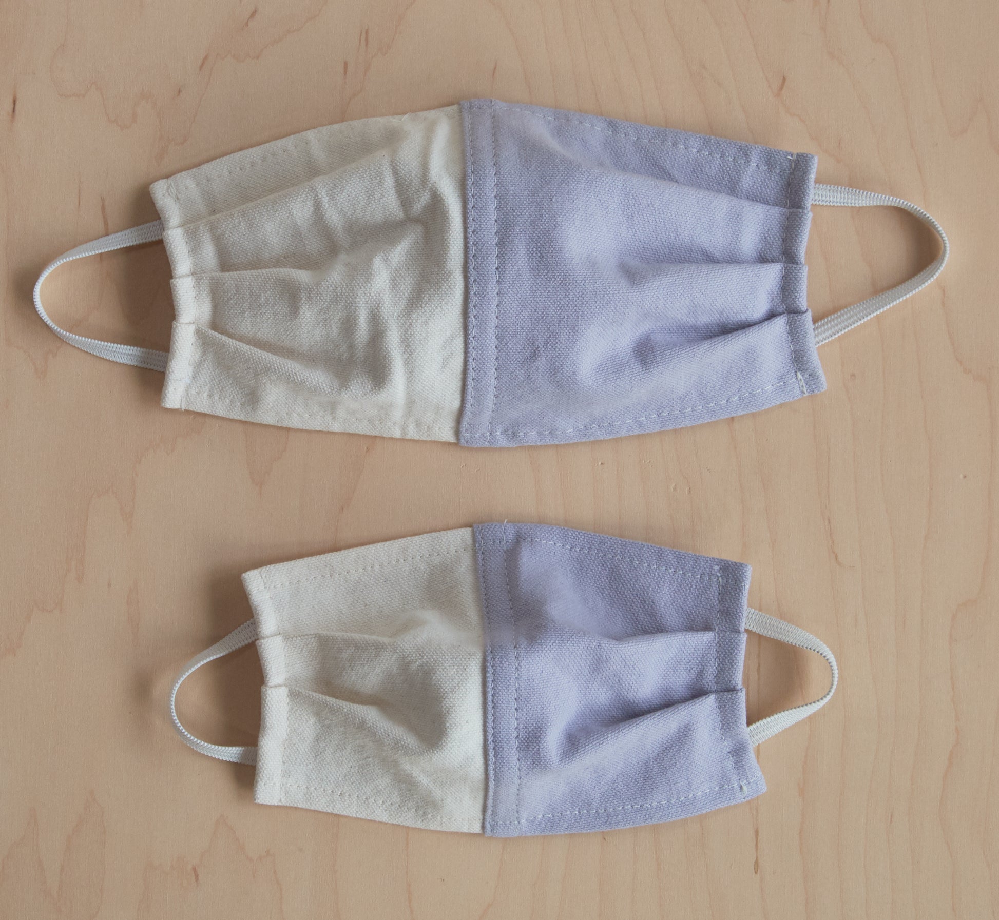 Kids Pine Masks flat on floor compared to adult sizes