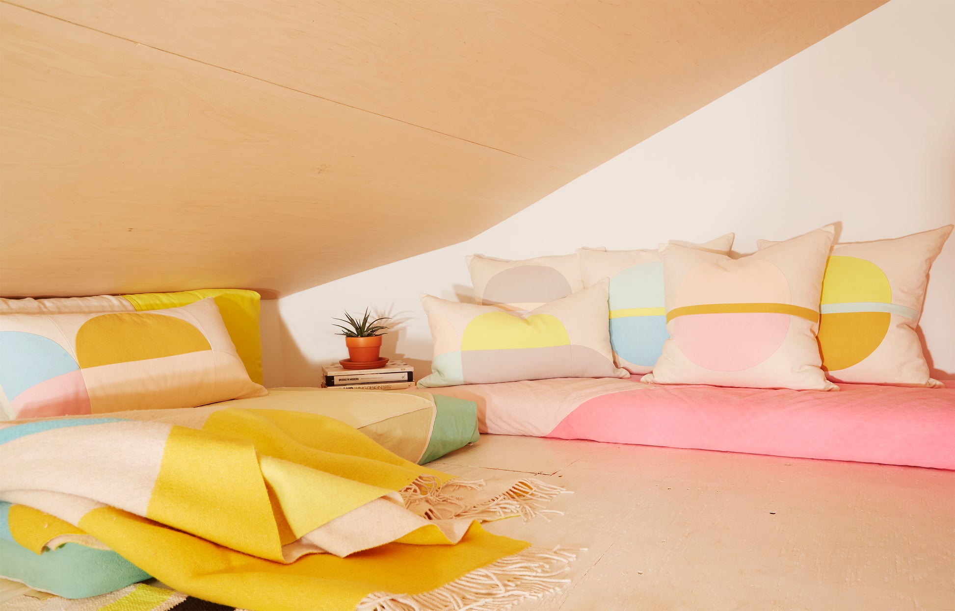 Re:Canvas Arco Cloud Square Pillow placed in bedroom