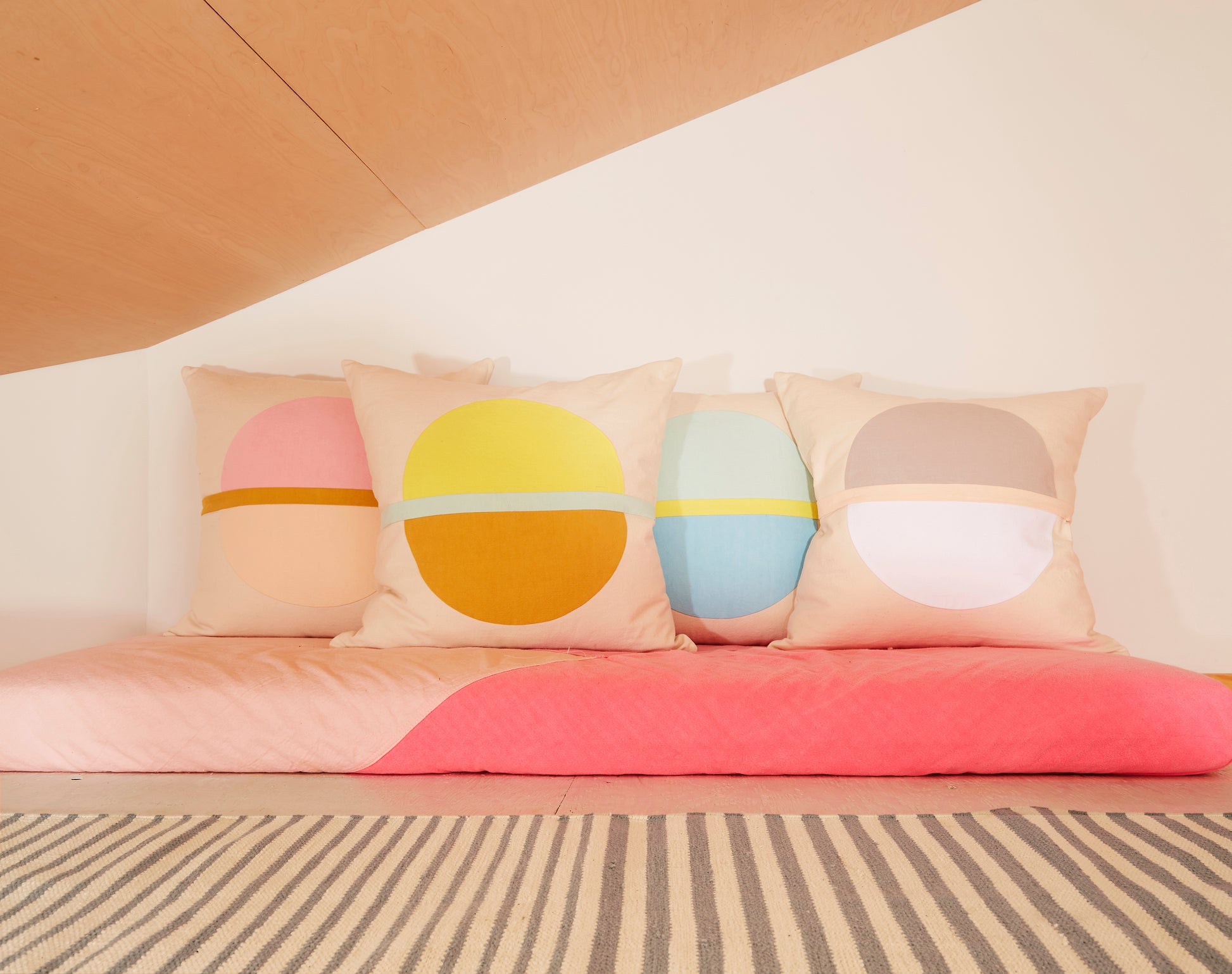 Re:Canvas Arco Canyon Lumbar Pillow placed in bed